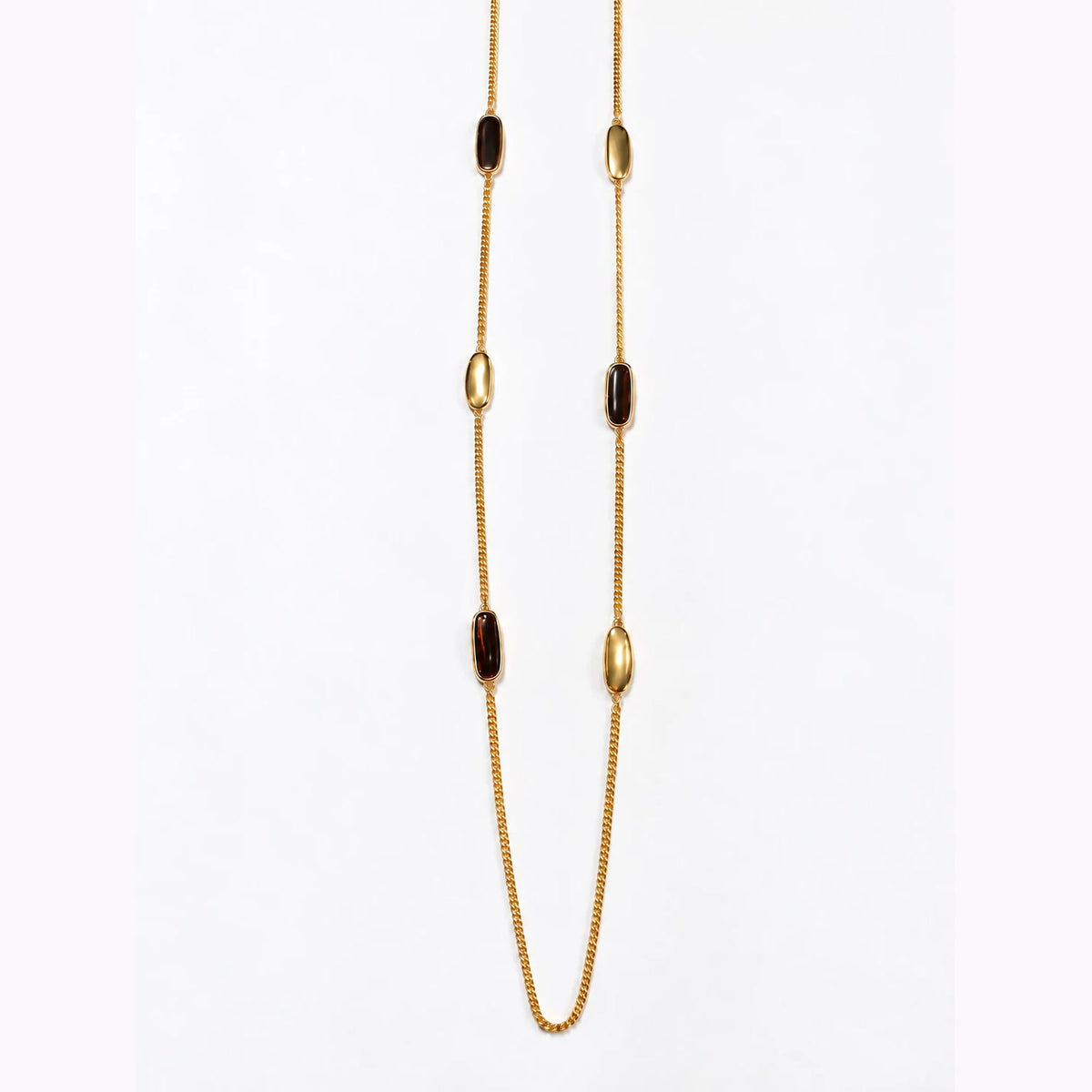 Sautoir Liora Bertalia, cabochons d'émail marron foncé sertis d'or sur une chaîne longue dorée
