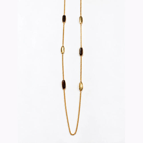 Sautoir Liora Bertalia, cabochons d'émail marron foncé sertis d'or sur une chaîne longue dorée